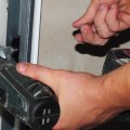 What are the signs that a garage door needs repair?